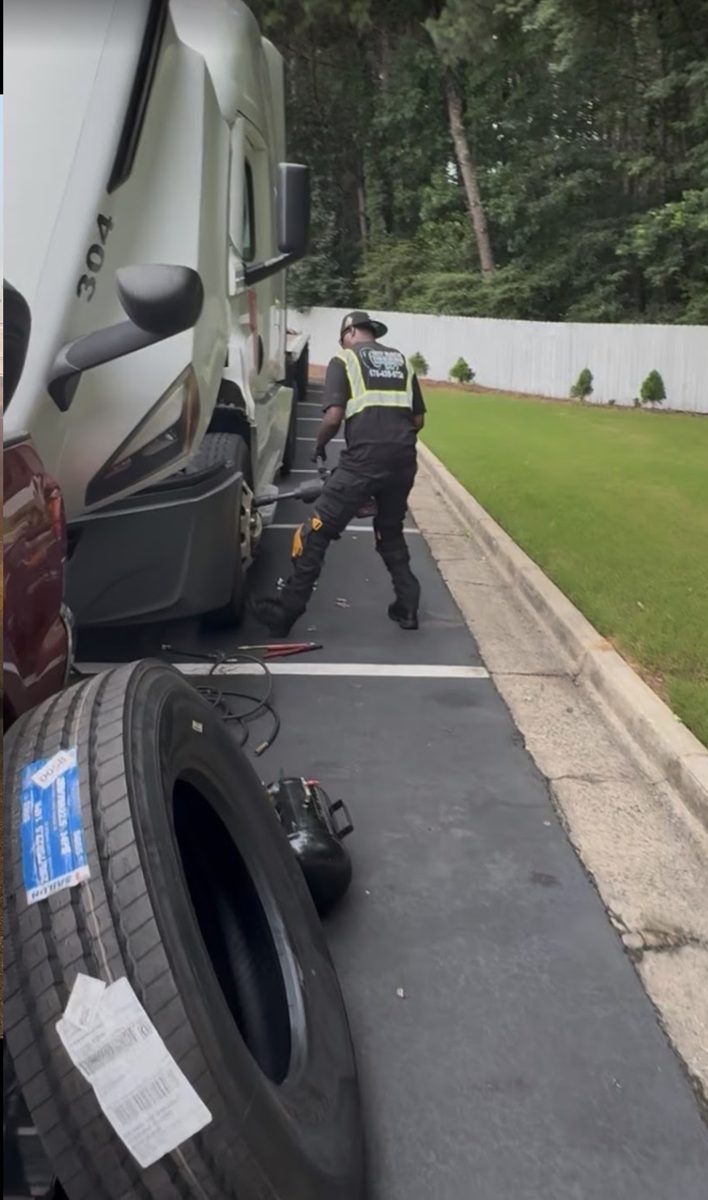 GBT technician mounting a new tire on a truck