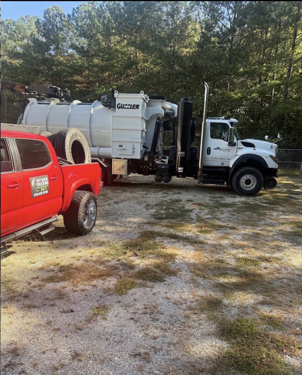 GBT service truck next to a commercial vacuum truck