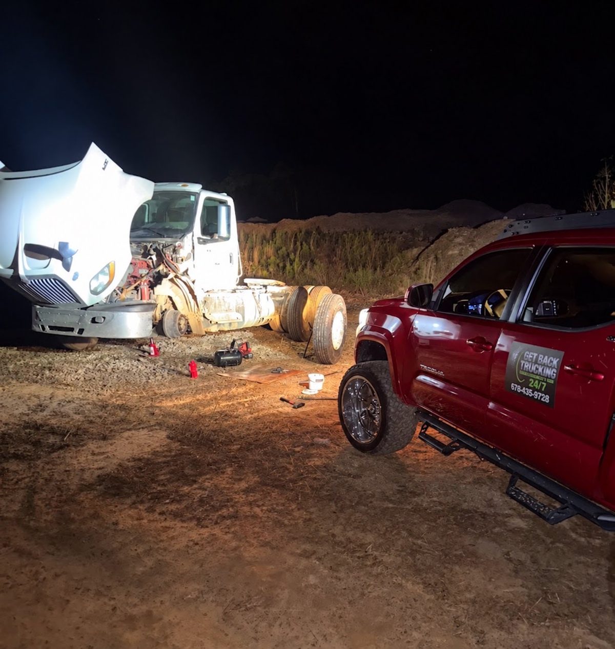 GBT mobile tire service truck working on a semi at night